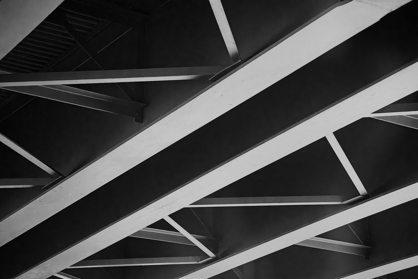 Intersecting structural steel beams seen from below